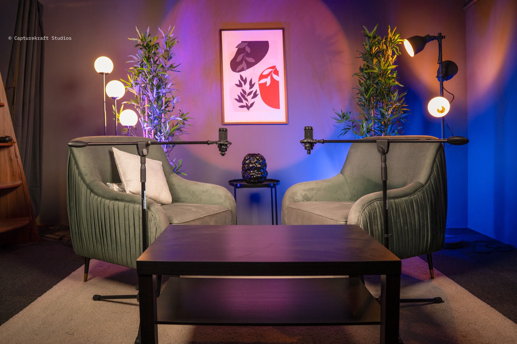 Afterglow Lounge set — moody purple-blue lighting with warm lamps