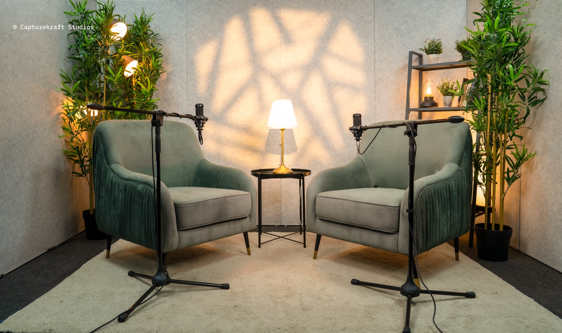 Clear Talk set — sage armchairs, warm lamp and patterned light
