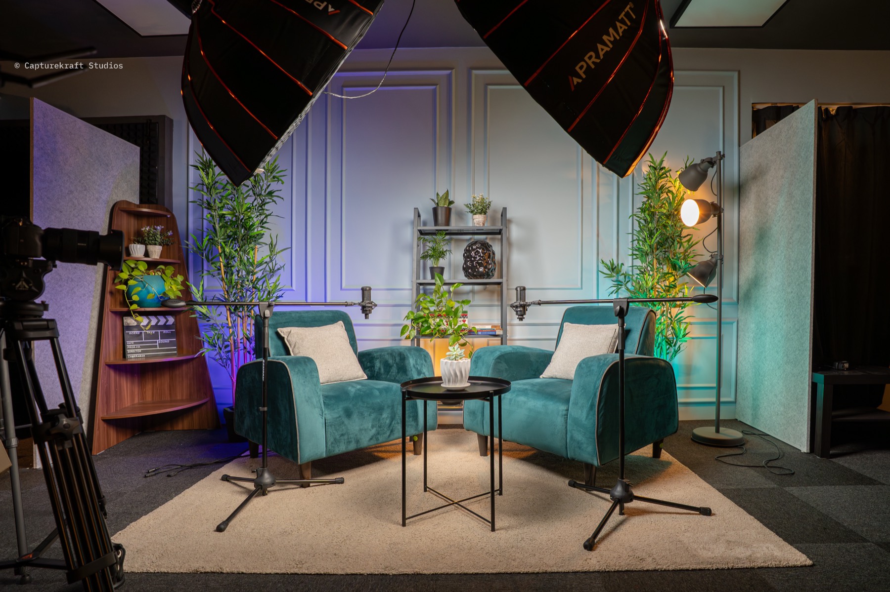 Garden Gallery set — teal armchairs, plants and wall mouldings